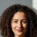 Portrait of a woman with dark curly hair
